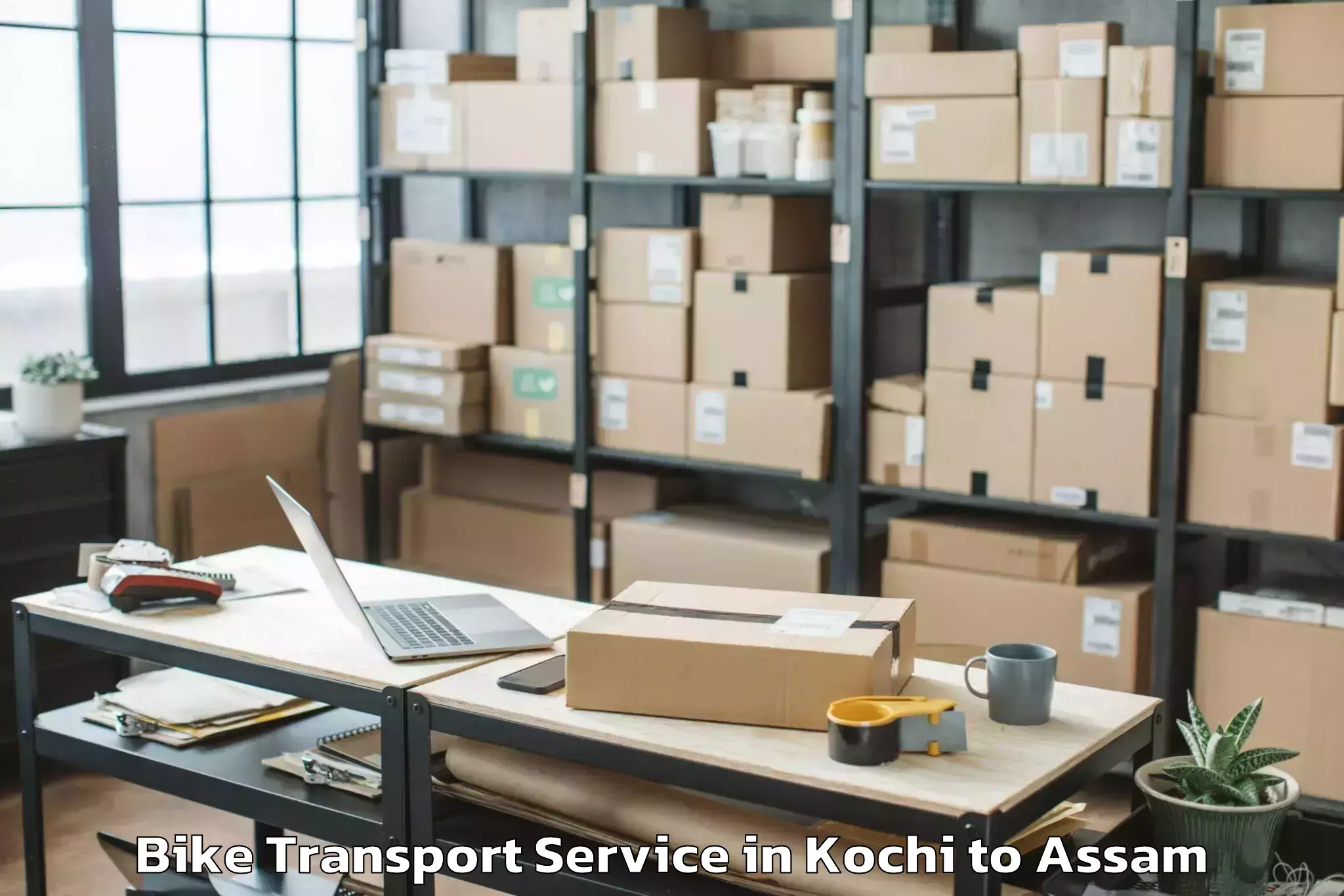 Book Kochi to Bilasipara Pt Bike Transport Online